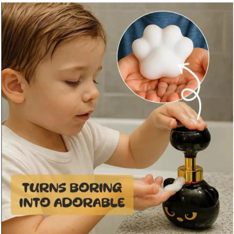 Black plastic cartoon cat-shaped foam soap dispenser measuring 10cm wide by 18cm tall