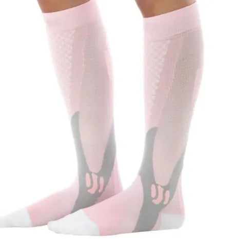 Graduated compression socks for men and women in black, shown laid flat.