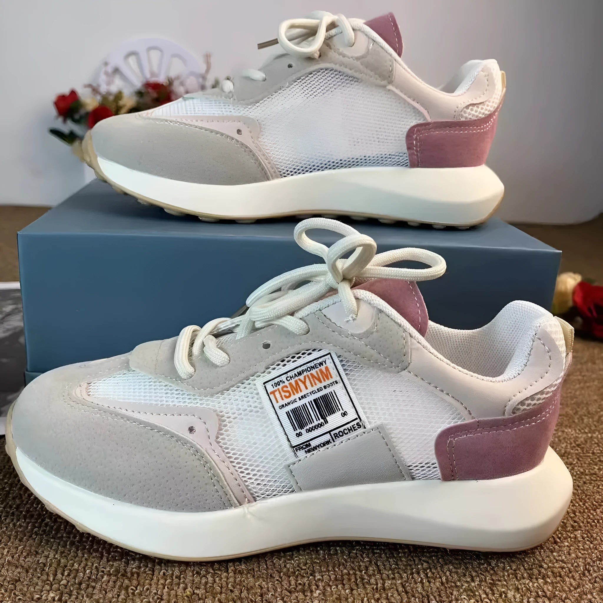 Women's grey and pink retro sneakers with mesh lining and rubber sole in low-top design