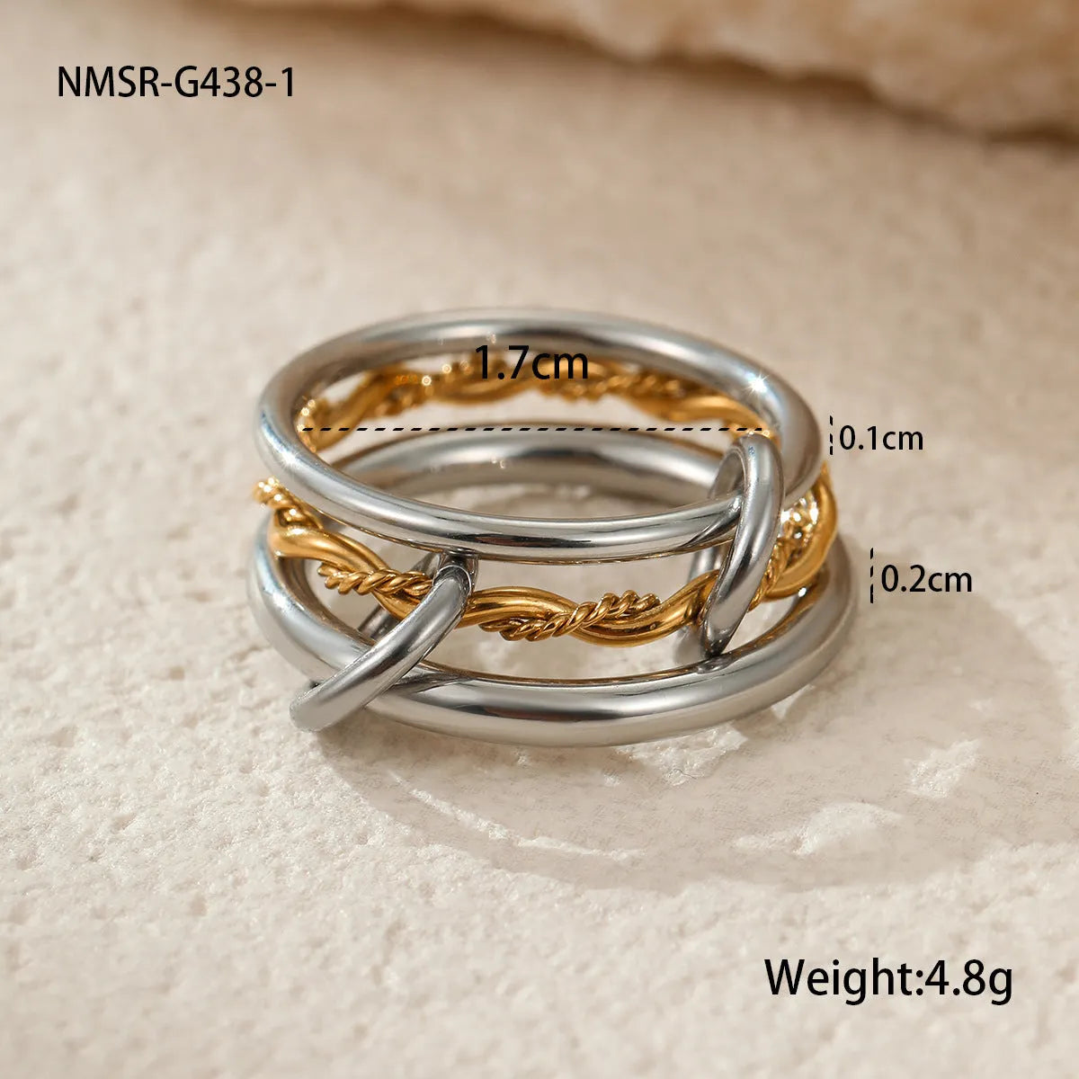 Gold plated exaggerated stackable ring for women on a hand, showing layered jewellery style.