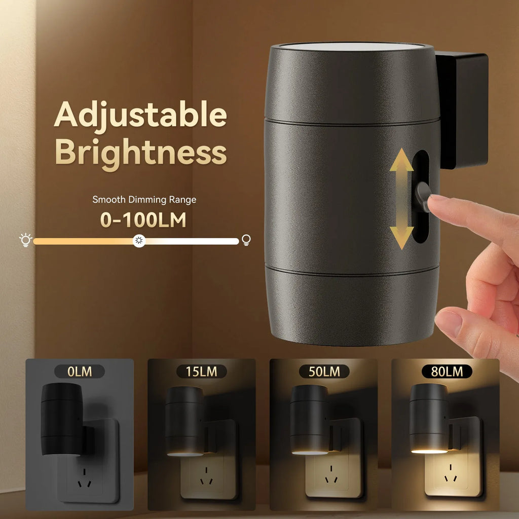 A compact white plug-in night lamp with a rotatable head, shown plugged into a wall socket.