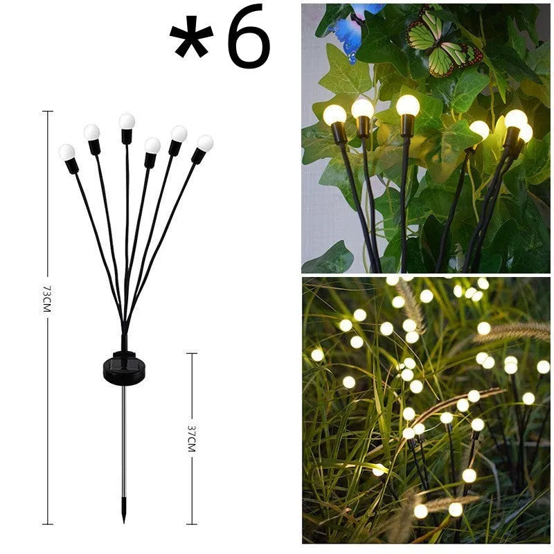 Solar-powered LED garden ground light with multiple light heads and a stainless steel spike for installation.