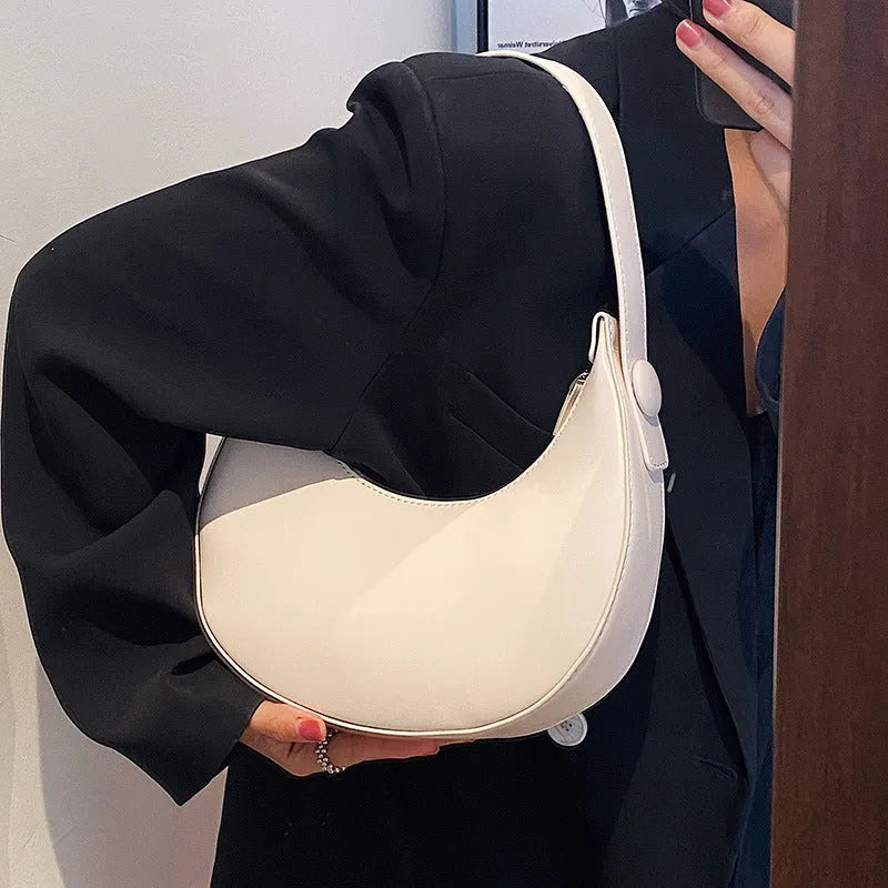 Women's retro dumpling shape shoulder bag in black with sandwich pocket and synthetic leather lining