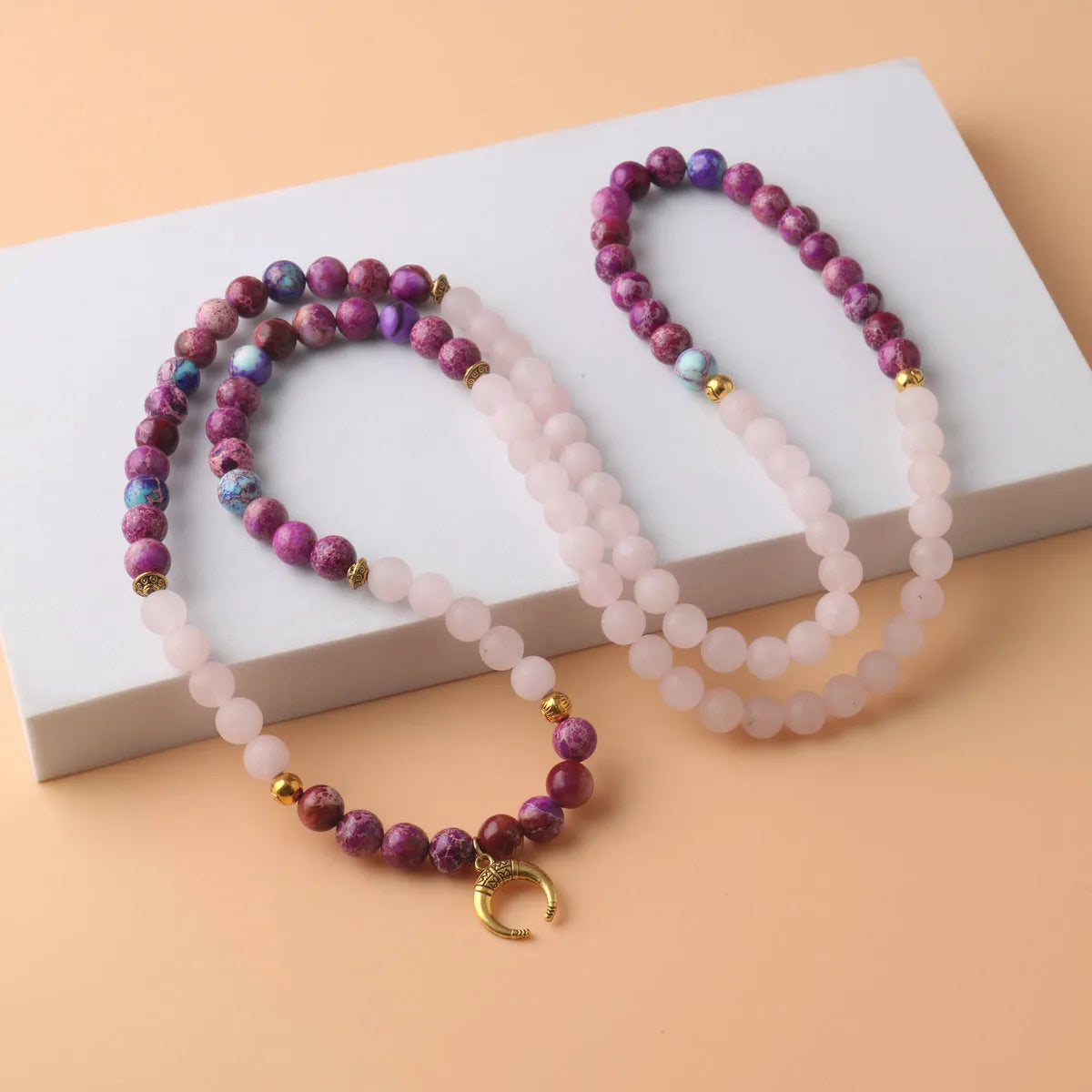 Pink crystal emperor stone round pendant necklace for casual unisex wear