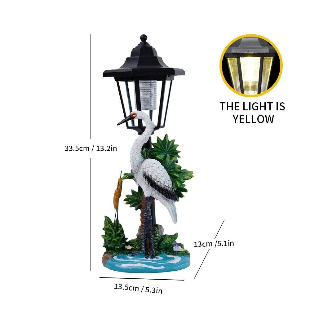 Solar hexagonal garden lamp with decorative resin figurine on plastic base for outdoor pathway lighting