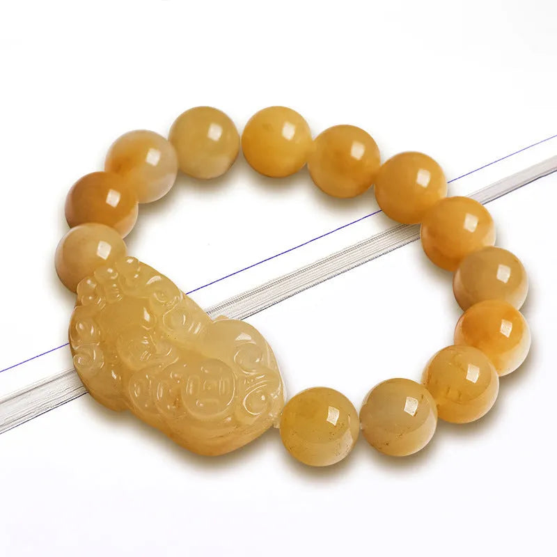 Golden thread jade bracelet with hand-carved money design showing two size options with jade beads