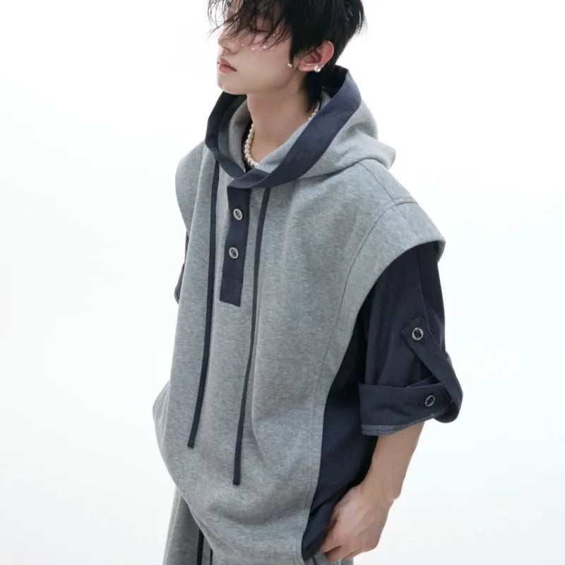 Men's black polyester sports suit with hooded short sleeve jacket and matching trousers laid flat