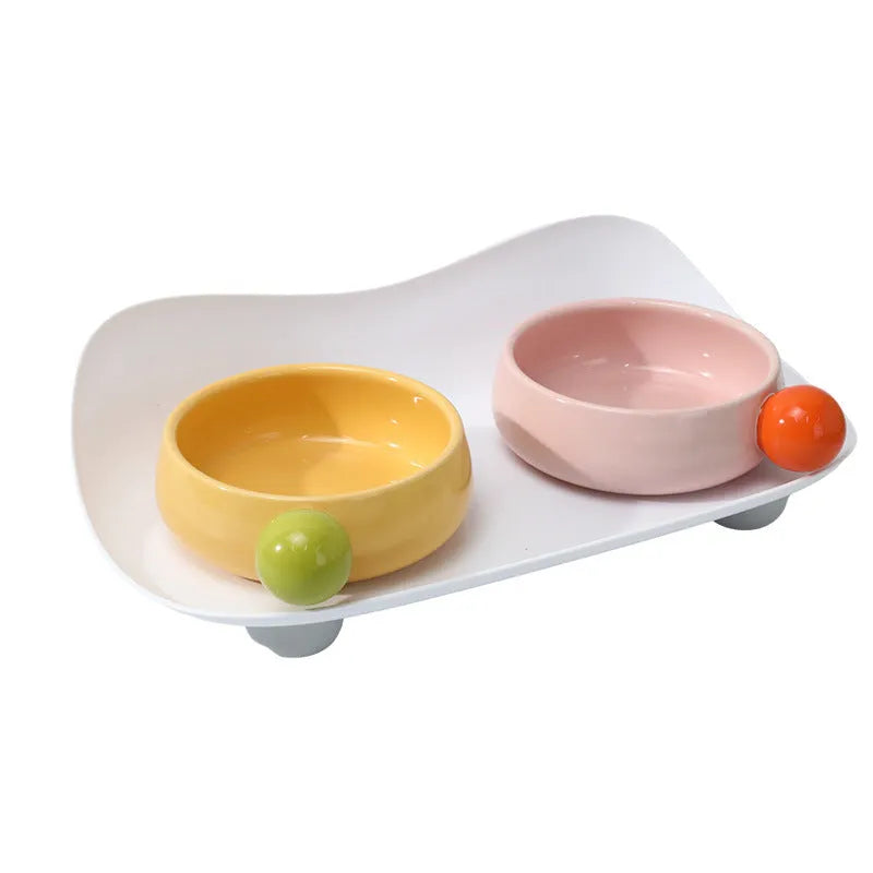 Pink double elevated ceramic pet bowl with non-slip base for cats and small dogs