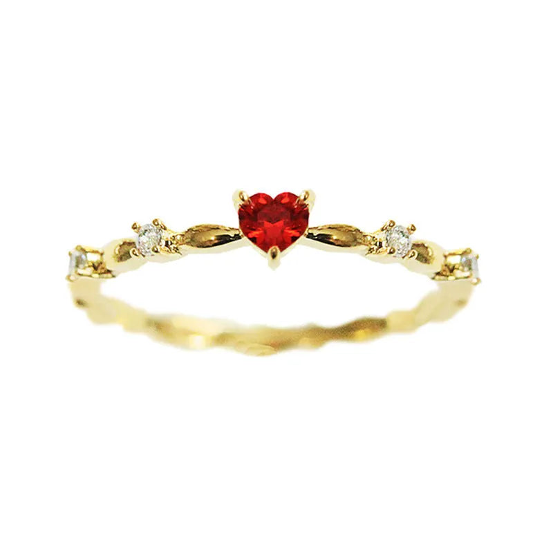 Gold and silver electroplated fashion ring with a peach heart charm and zircon stone.