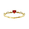 Gold and silver electroplated fashion ring with a peach heart charm and zircon stone.