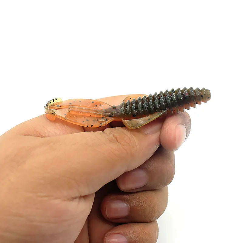 8cm PVC fishing soft bait lure in multiple colour variations against fishing tackle background