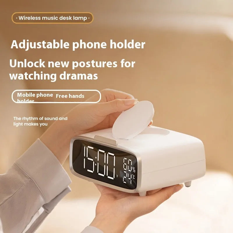 White ABS acrylic Bluetooth speaker wireless charging night lamp on a surface.