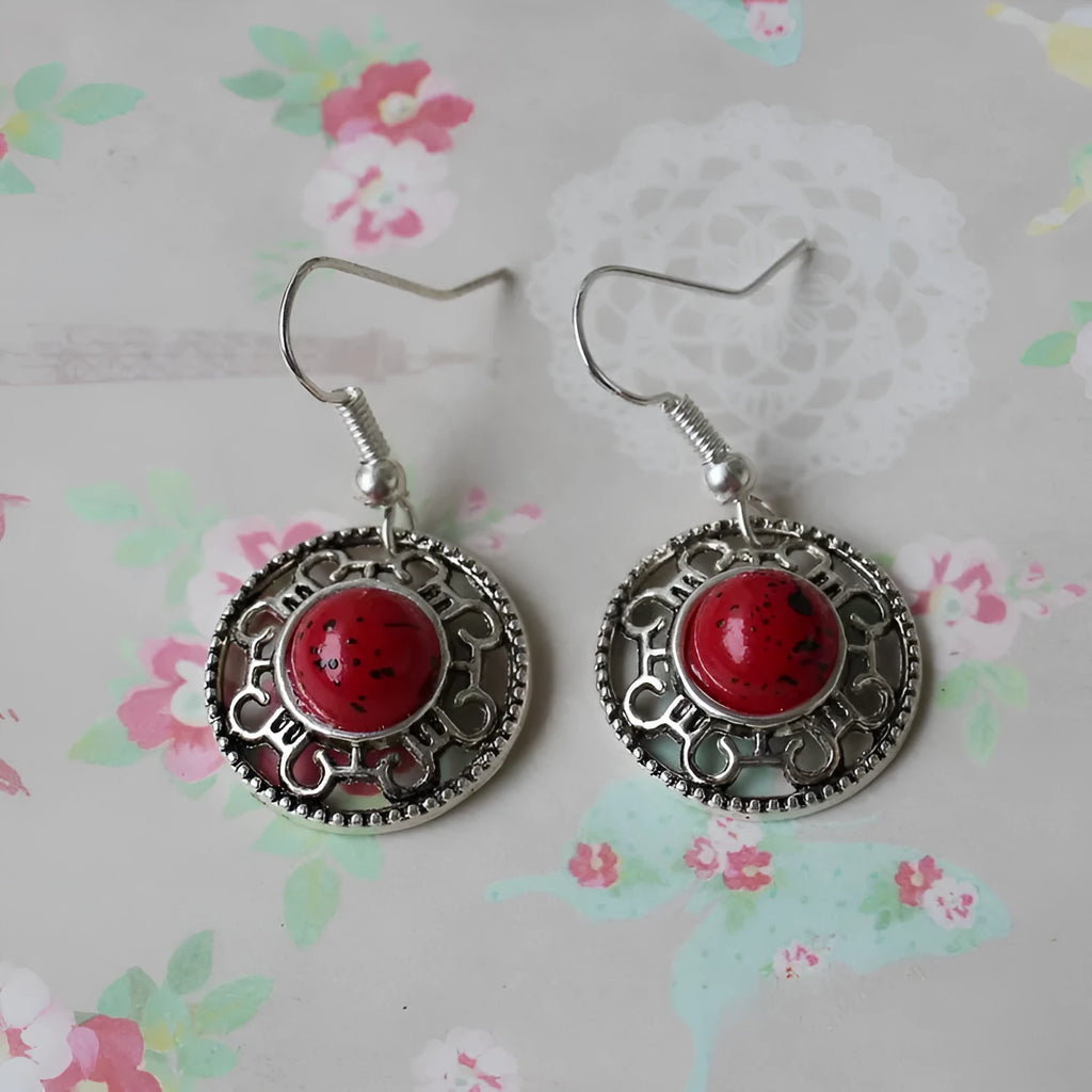 Handmade Miao silver ethnic earrings with turquoise stones in geometric flower disk design