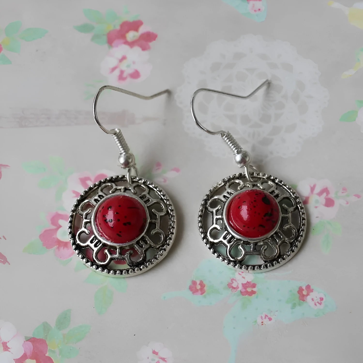 Handmade Miao silver ethnic earrings with turquoise stones in geometric flower disk design