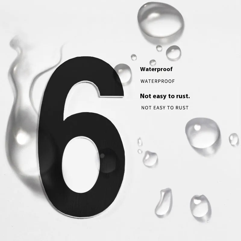 Black stainless steel house number with adhesive backing showing 7.5cm character size