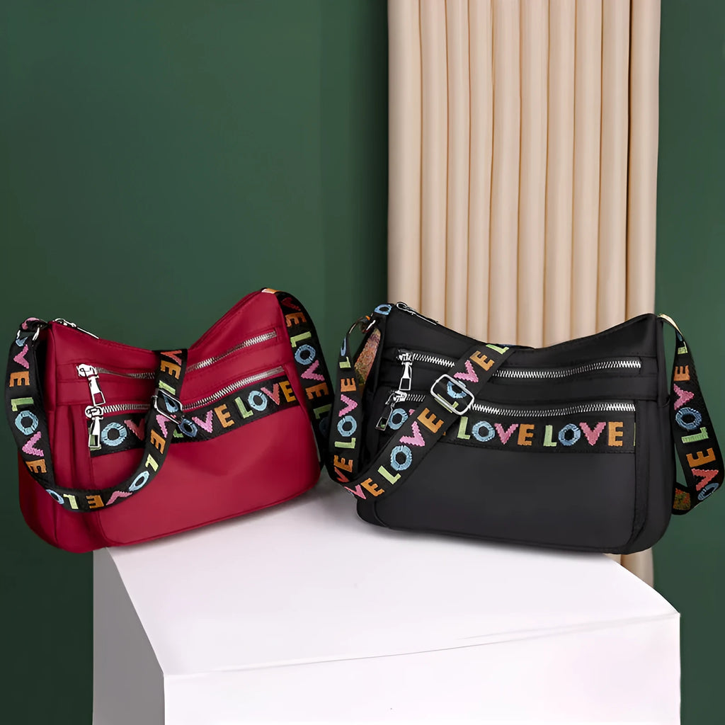 Soft oxford cloth crossbody shoulder bag with multiple pockets, letter stitching, available in black and red