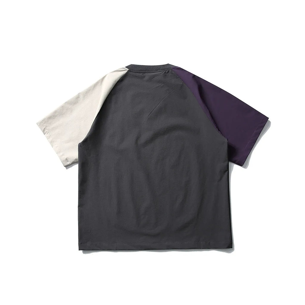 Dark grey loose fit t-shirt with contrast colour raglan short sleeves.