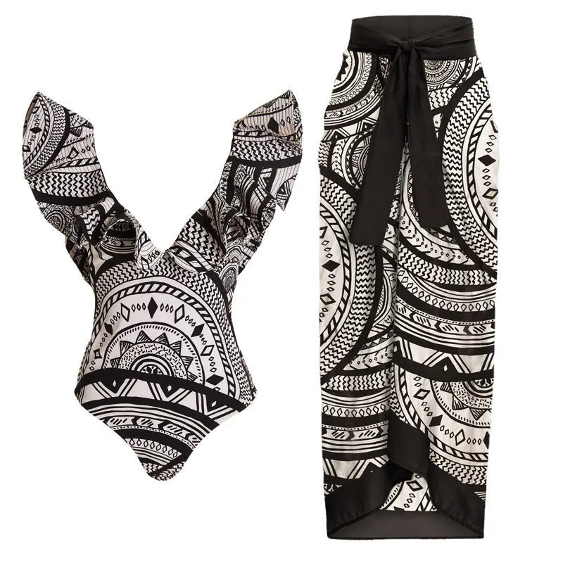 Women's vintage print one-piece swimsuit with deep V-neck, ruffles, and a matching wrap skirt.