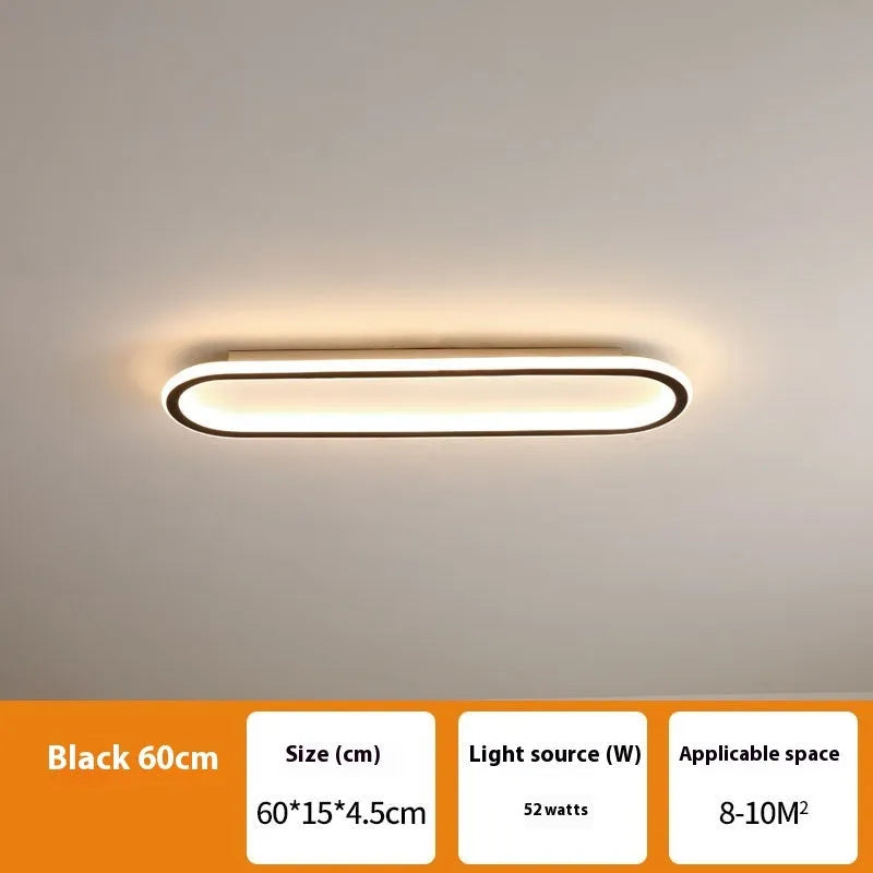 Black aluminium strip ceiling lamp with PVC shade in 60cm length mounted on a white ceiling.
