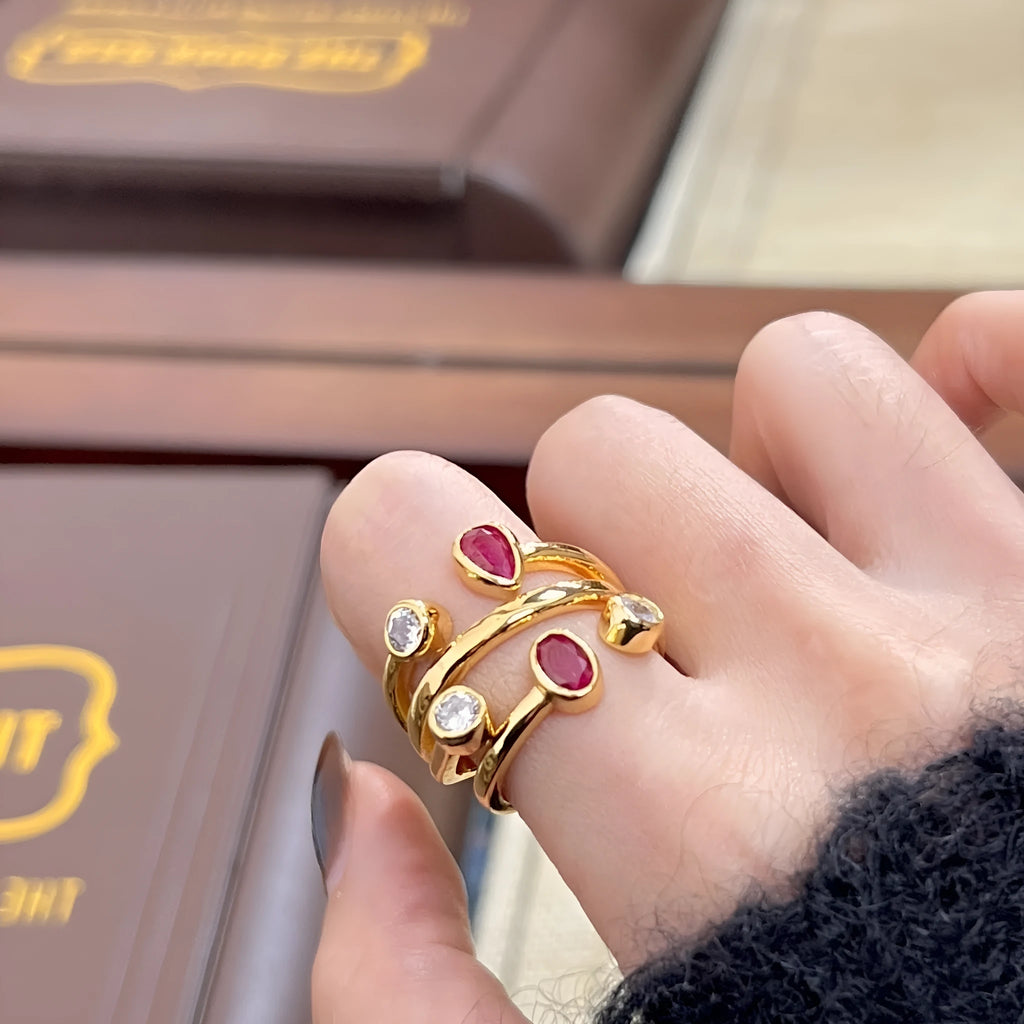 Irregular geometric cross ring with two-tone colour and group diamond setting in retro style