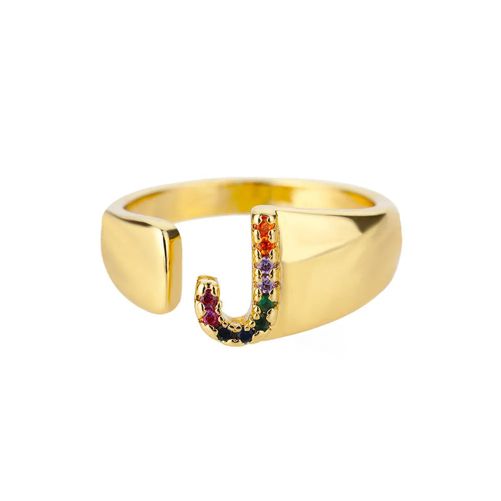 Fashion micro-set colored zirconium adjustable open ring showing letter A on a copper electroplated base
