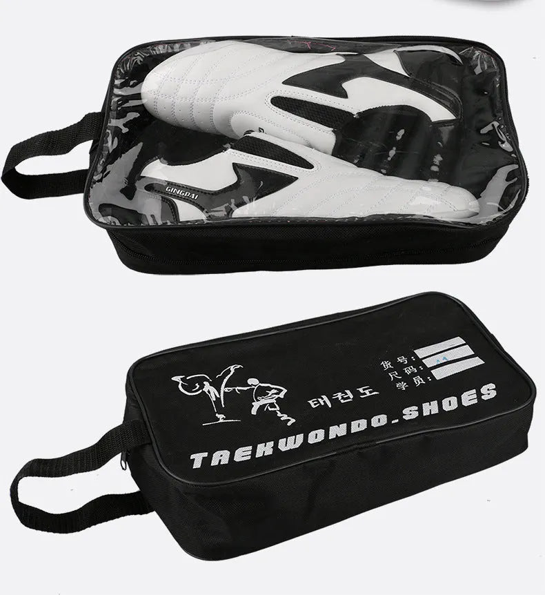 Black and white children's martial arts training shoes with a soft sole and widened design.