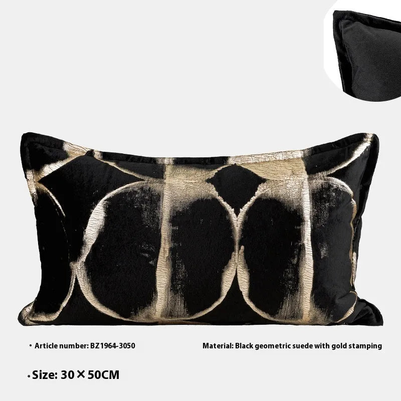 Black gold abstract pattern decorative flannel cushion on a sofa, showing removable cover.