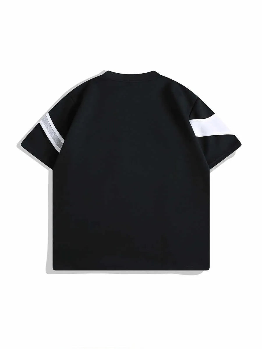 Man's black short sleeve T-shirt showing detail of double stitching and padded shoulder on a hanger.