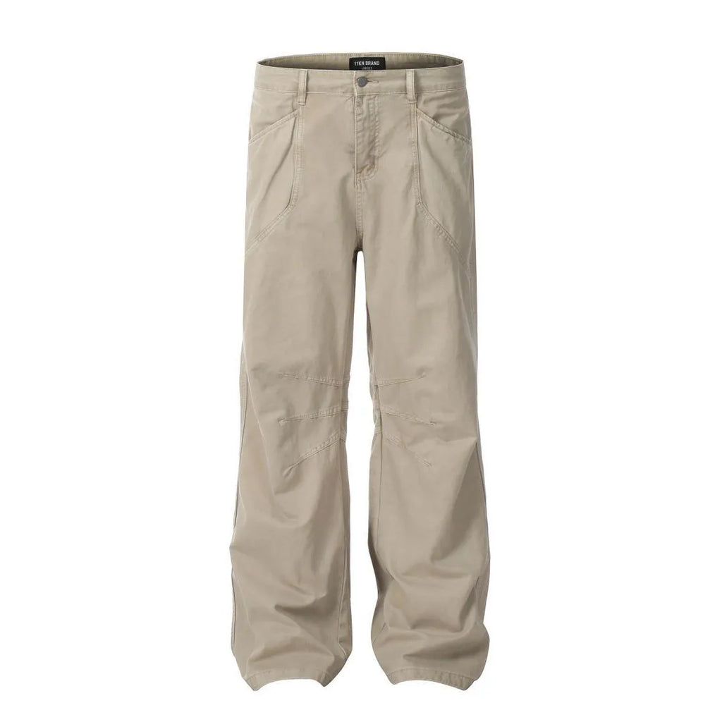 Men's brown loose straight leg high waist cotton trousers laid flat.