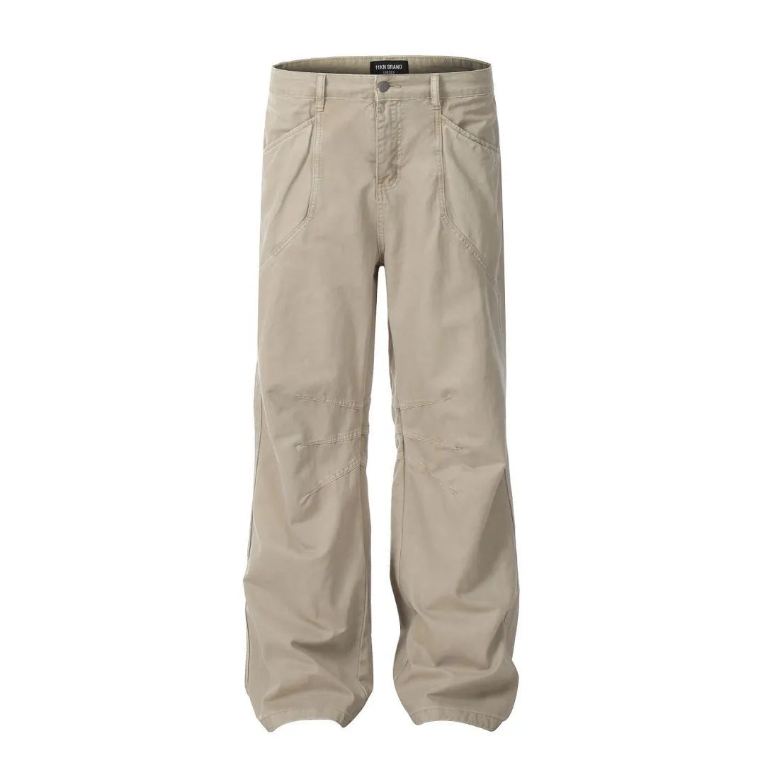 Men's brown loose straight leg high waist cotton trousers laid flat.