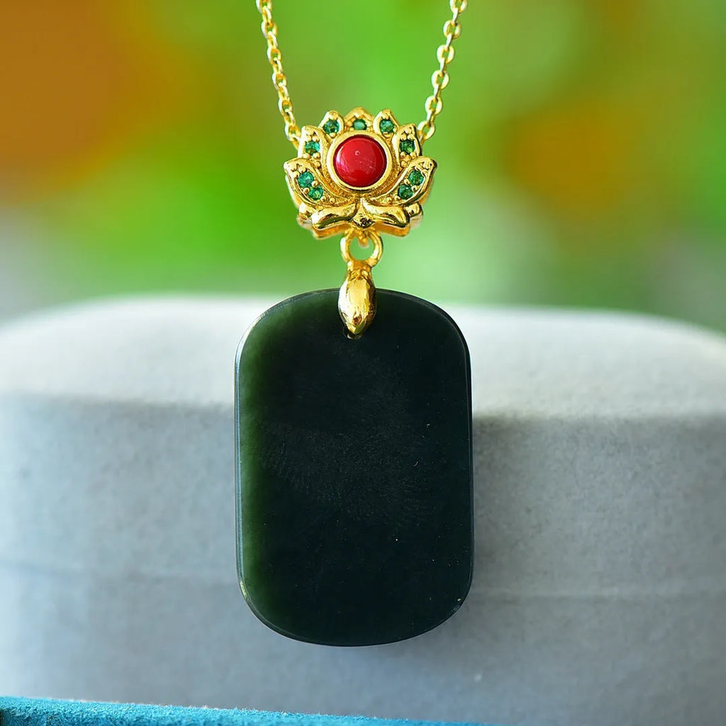 Flat grey Hetian Jade pendant with copper inlay and blue jadeware detail on a silver chain.