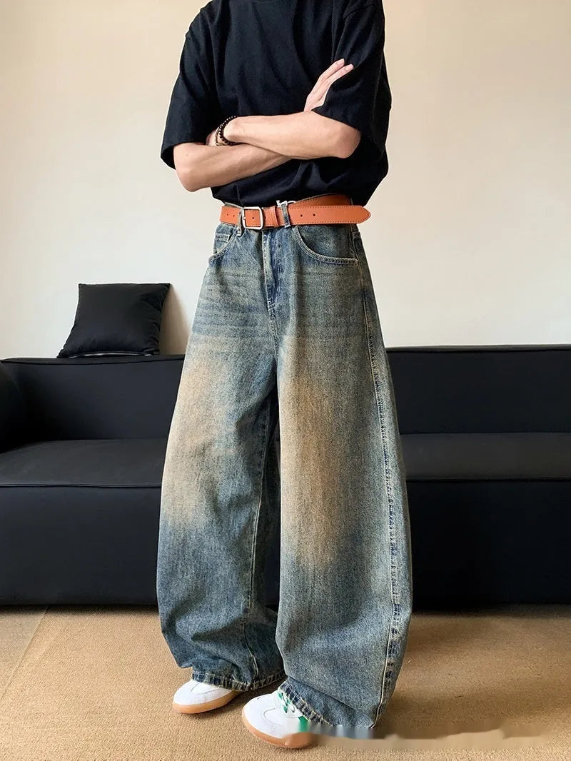 Men's retro blue distressed denim jeans with wide-leg silhouette and micro elasticity fabric