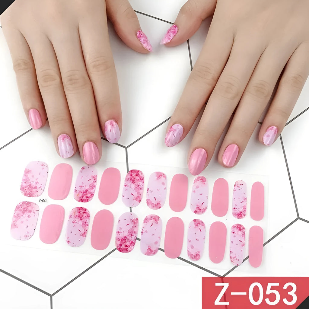 Korean nail sticker sheets showing cartoon designs including strawberries, flowers, bows and chains with nail file