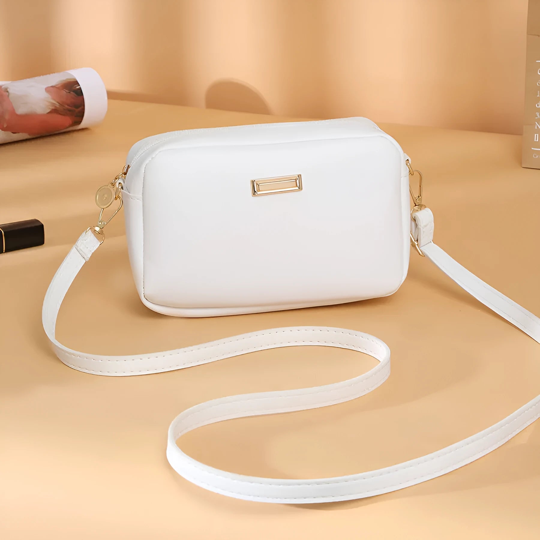 Women's solid colour PU leather shoulder bag with three-dimensional pocket and square shape.