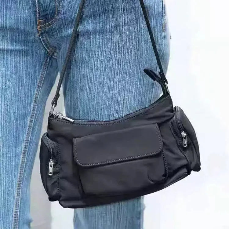 Black lightweight women's shoulder bag with double pockets and side line detailing
