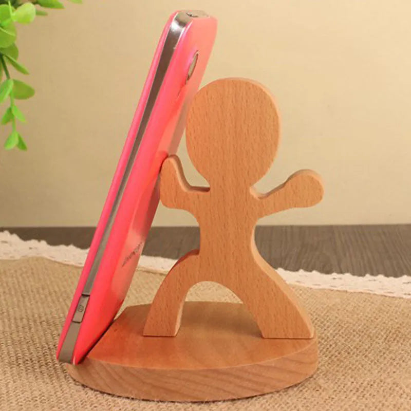 Beech wood mobile phone holder stand with coin slot and decorative carving.