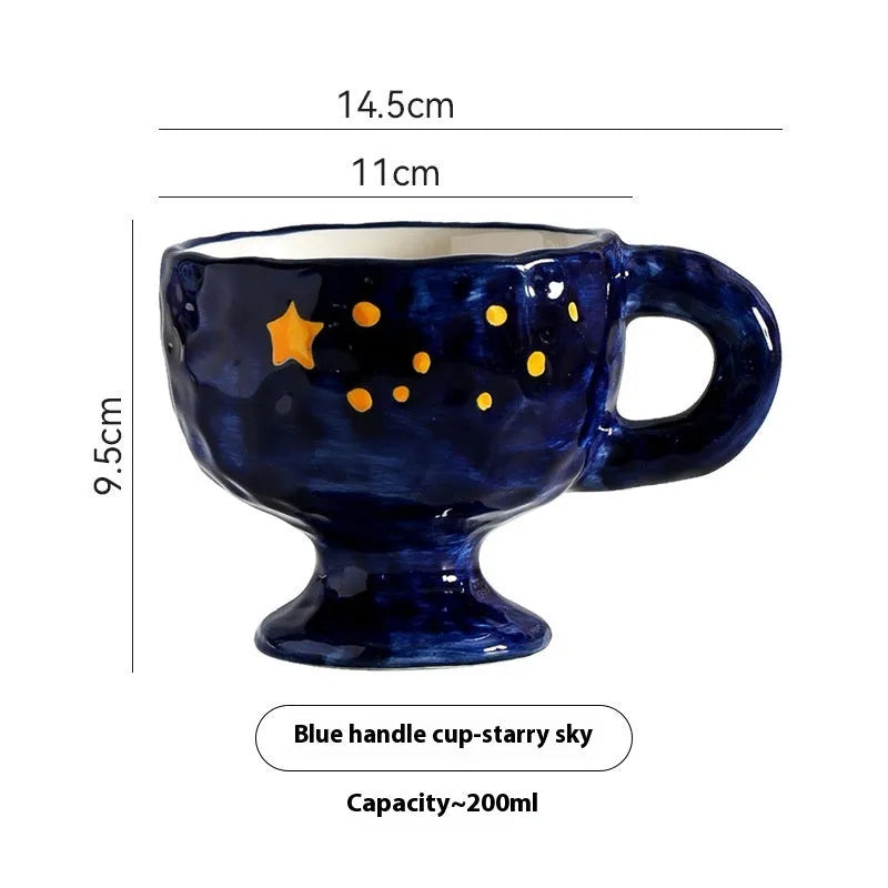 Hand-pinched irregular shaped ceramic mug in a solid colour on a table.