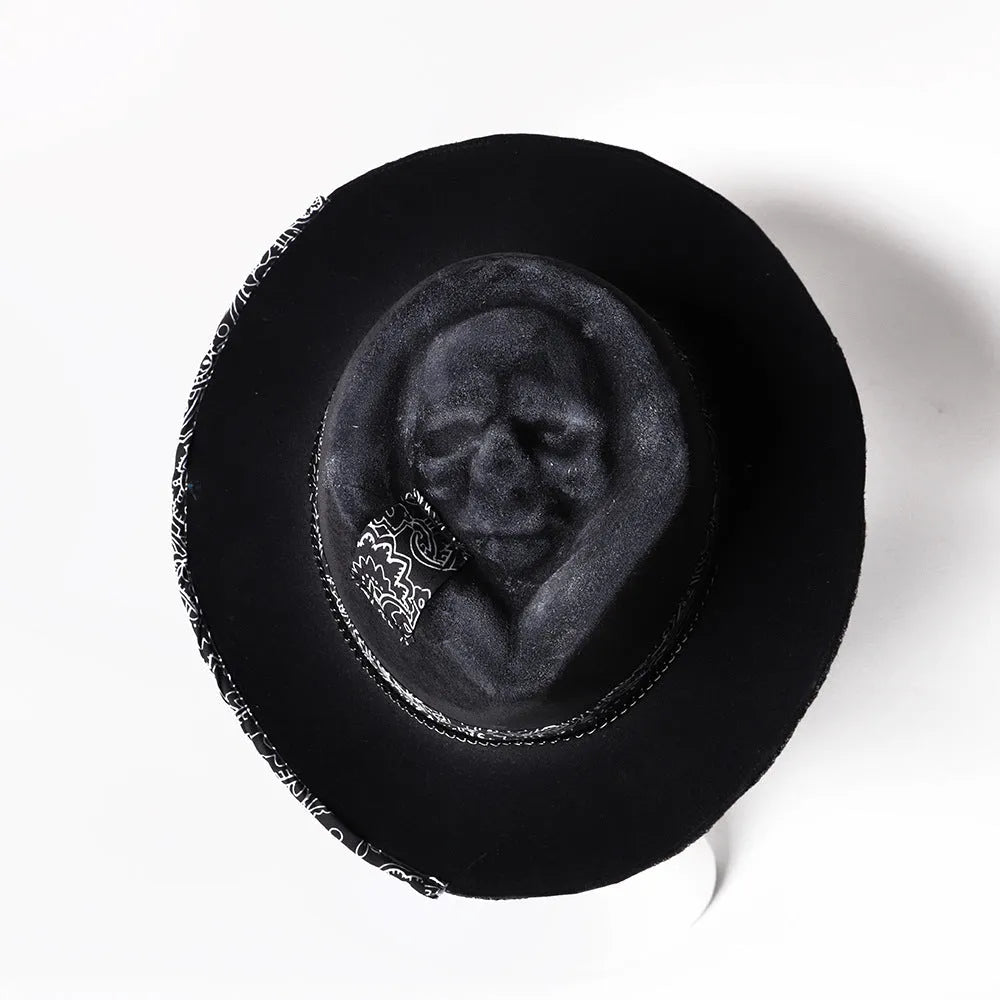Handmade wool felt skull hat with a conical crown on a model, shown in the skull hat colour variant.