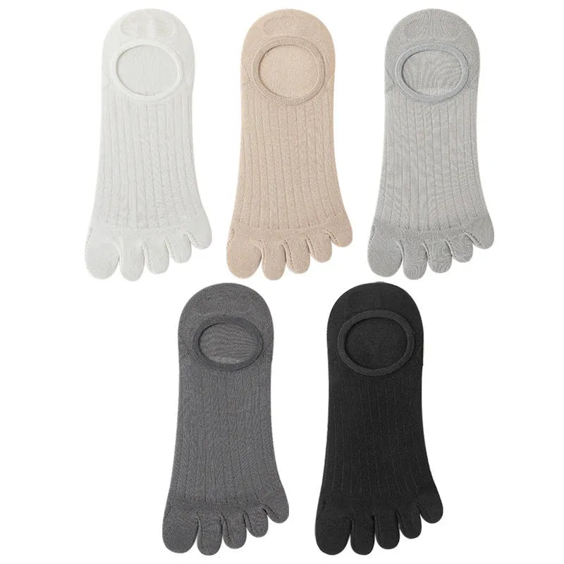 Modal five-finger boat socks in black, shown on a foot with invisible no-show style.