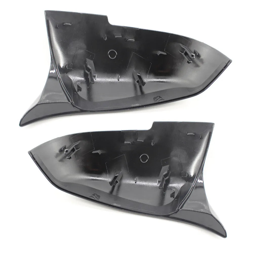 Pair of paint bright black BMW rear-view mirror replacement shells for 3 Series and 4 Series models.