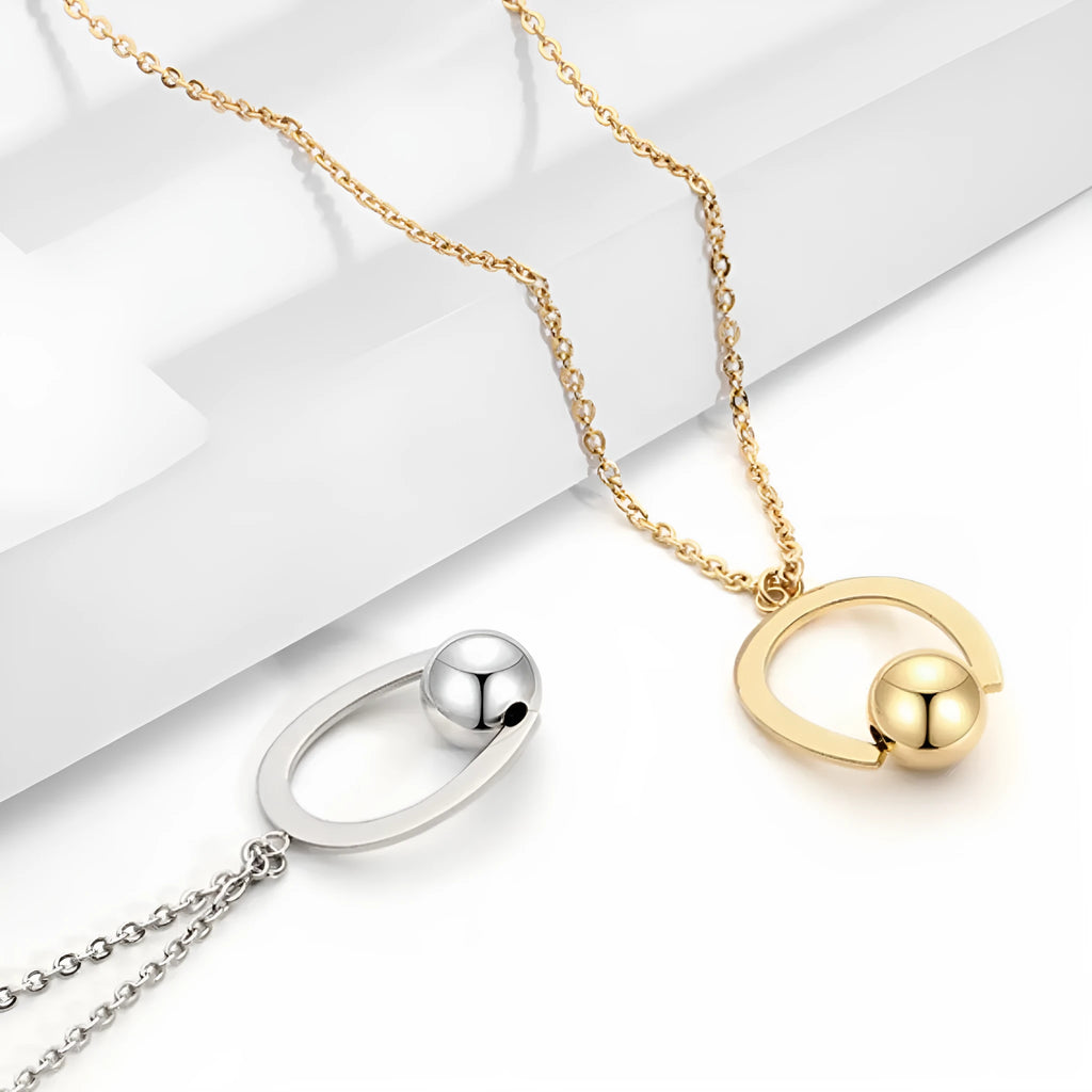 Stainless steel necklace with geometric pendant on adjustable cross chain in gold or silver finish