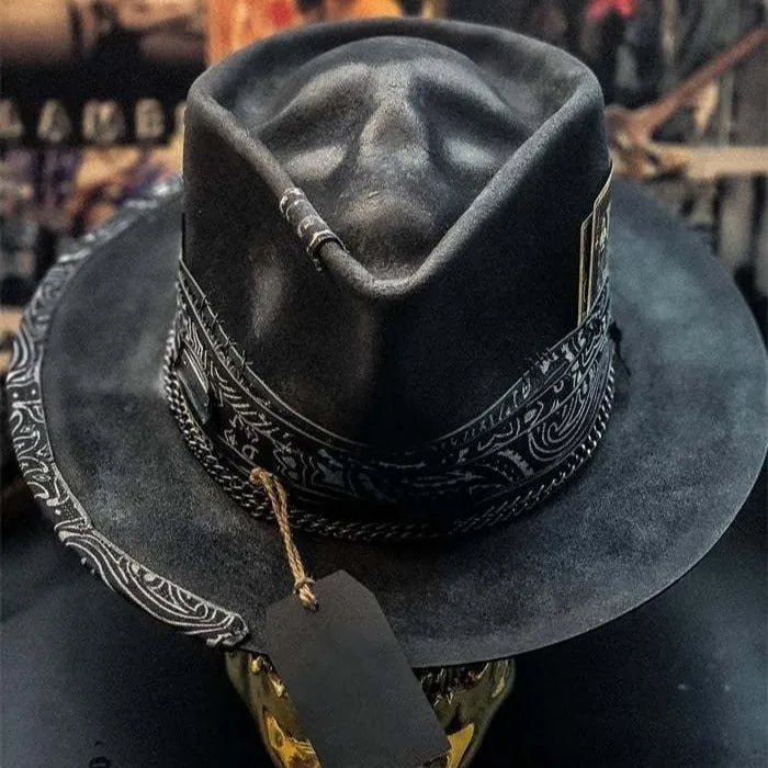 Handmade wool felt skull hat with a conical crown on a model, shown in the skull hat colour variant.