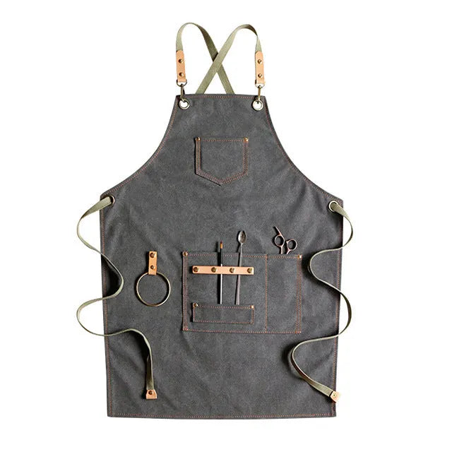 Canvas cross strap apron in camel colour shown from the front.