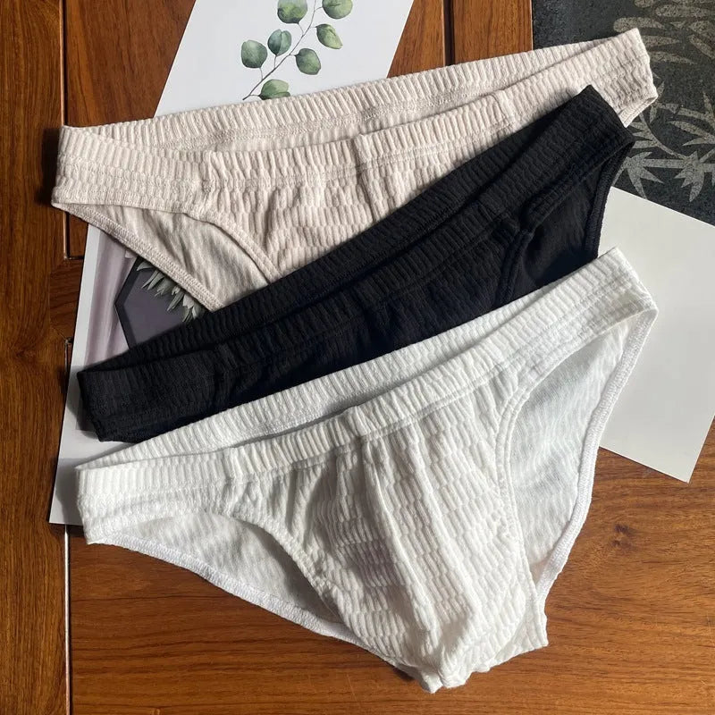 Men's solid colour pure cotton triangle briefs with a mid-waist body-shaping design.