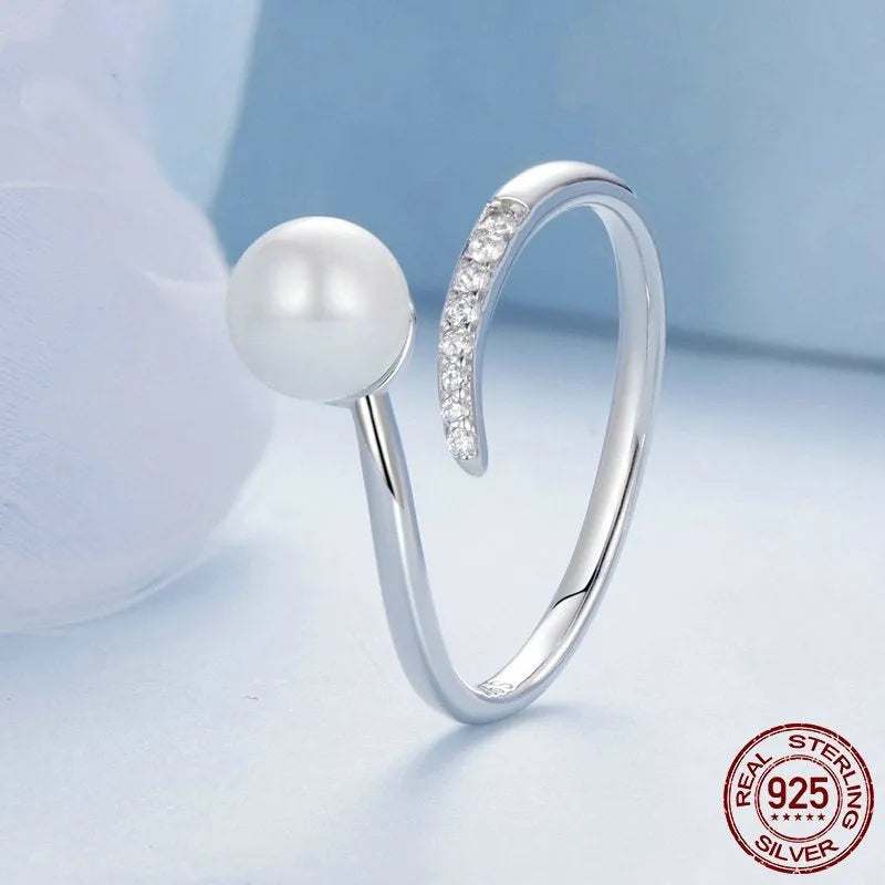 Adjustable S925 sterling silver ring for women featuring a natural shell pearl on an open loop band.