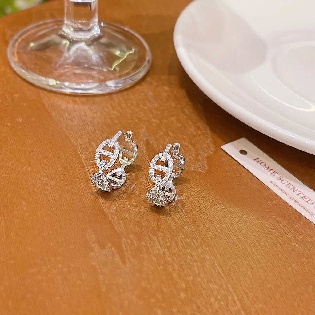 Ladies casual earrings with diamond-effect design in silver, gold, or rose gold metallic finishes