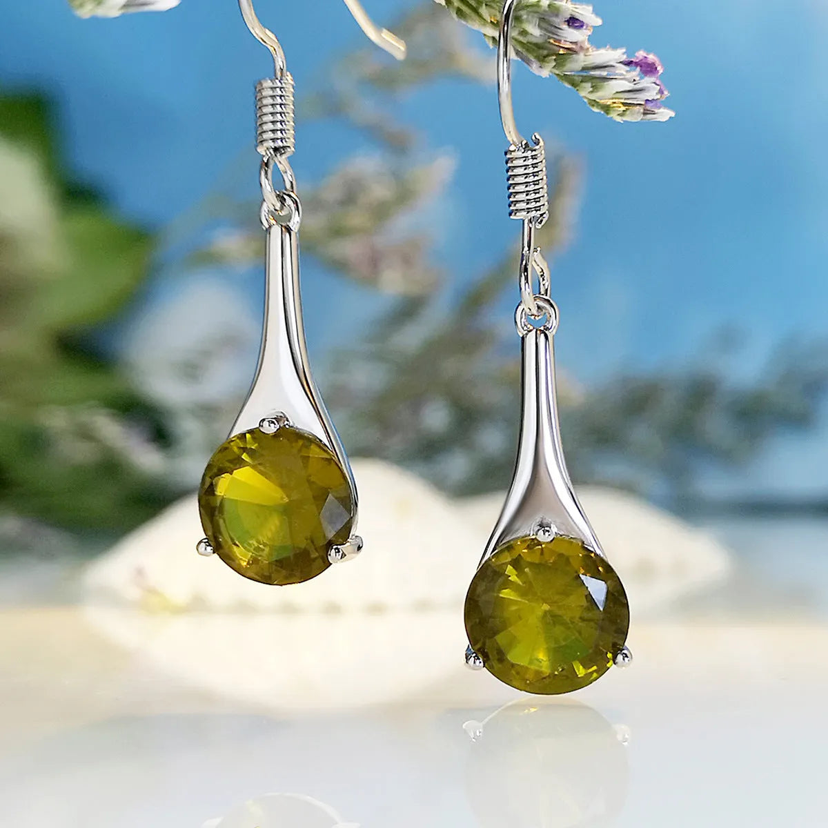 Olive green topaz drop earrings with water drop shape and retro styling