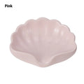 Plastic shell-shaped soap dish in pearl white or pink colour for bathroom organisation