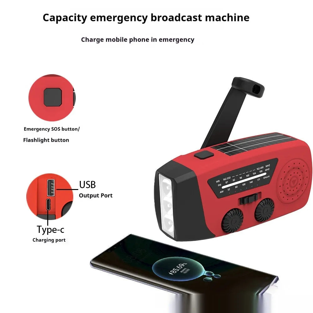 Red rechargeable handheld torch and radio unit with wrist strap and USB charging port.