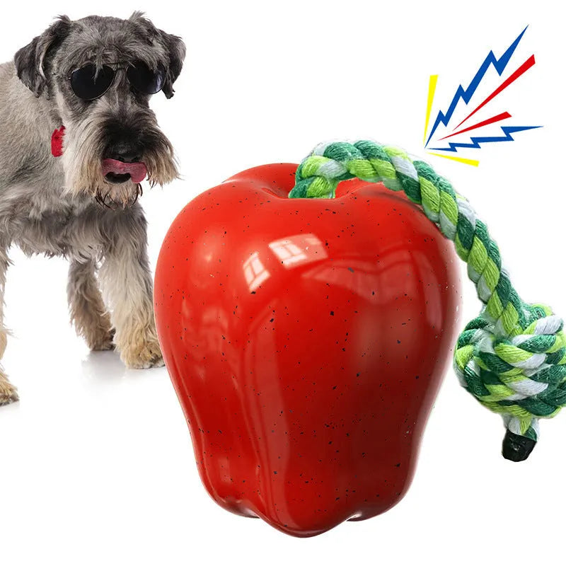 Green plastic dog dropping ball toy with squeaker for outdoor fetch and chewing